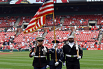 3 Color Guard members presenting before the start of a St. Louis Cardinals game