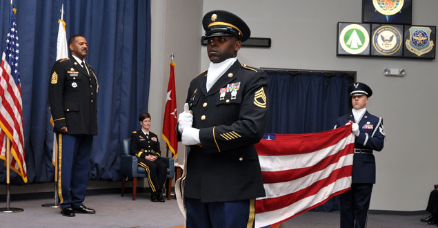 2 Members prepare for a flag folding during a retirement ceremony
