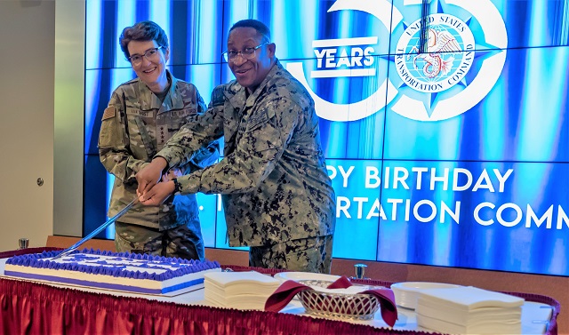 Air Force Gen. Jacqueline Van Ovost, commander, U.S. Transportation Command, and Fleet Master Chief Donald O. Myrick, senior enlisted leader, cut a birthday cake to celebrate the 35th anniversary of the command at USTRANSCOM headquarters, Scott Air Force Base, Ill., Sept. 29, 2022. With its global reach, USTRANSCOM spans the world in logistics by integrating and employing mobility forces to rapidly project combat power at the time and place of our country's choosing. (photo by Oz Suguitan/Released)