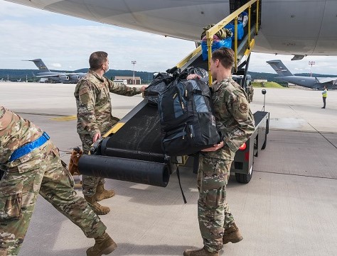 U.S. Air Force Airmen assigned to the 721st Aerial Port Squadron load luggage onto an American Airlines aircraft during Operation Allies Refuge at Ramstein Air Base, Germany, Aug. 27, 2021. Civil Reserve Air Fleet Aircraft are being used for the onward movement of evacuees from temporary safe havens and interim staging bases. (U.S. Air Force photo by Tech. Sgt. Donald Barnec)